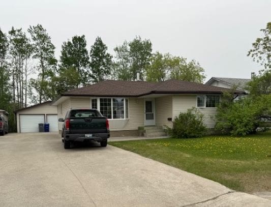 House with driveway and parked truck.