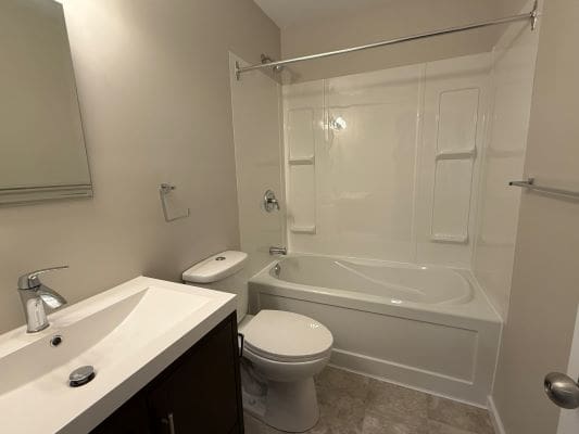Modern bathroom with bathtub and sink.