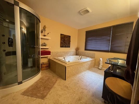 Modern bathroom with shower and bathtub.