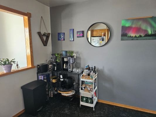 Home coffee station with wall decor.