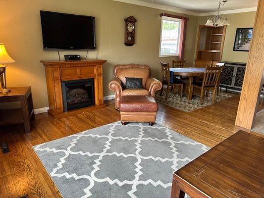 Living room with fireplace and dining area.