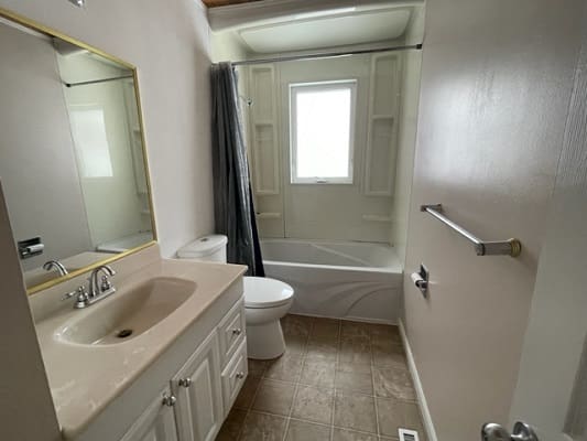Small bathroom with sink and bathtub.