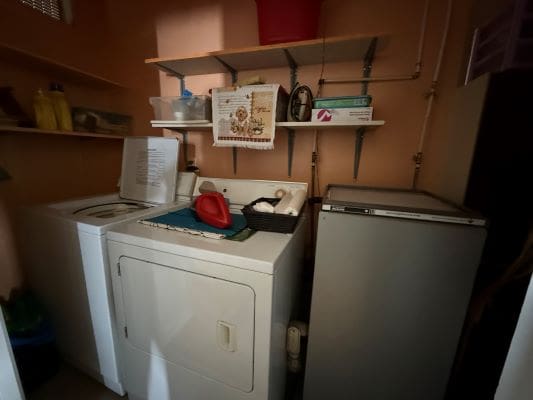 Small laundry room with washer and dryer.
