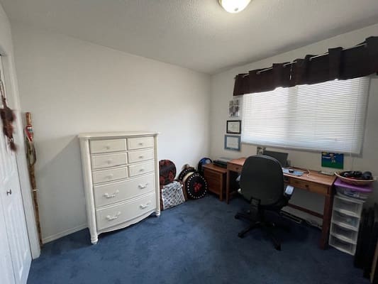 Simple home office with desk and chair.