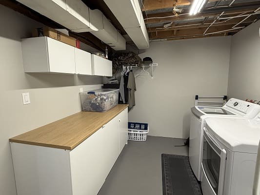 Basement laundry room with washer and dryer.