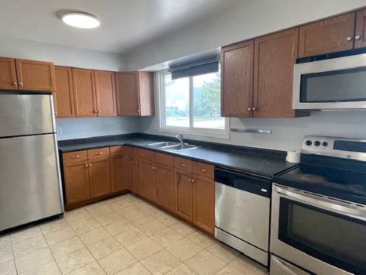 Modern kitchen with stainless steel appliances.