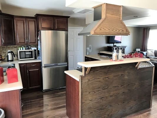 Modern kitchen with wooden cabinets and island.