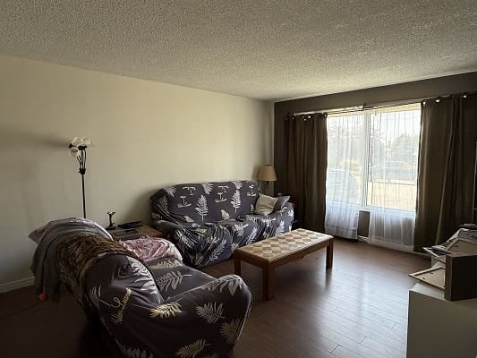 Cozy living room with large window view.