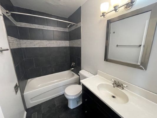 Modern bathroom with tub and vanity.