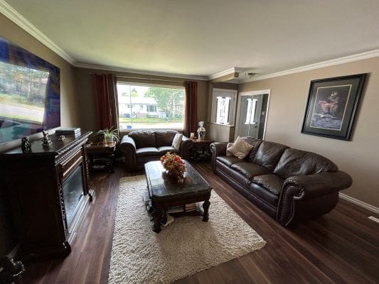 Cozy living room with leather furniture.