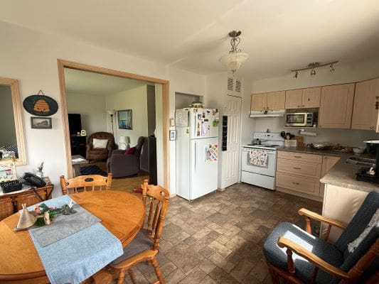 Cozy kitchen and dining area with decor.