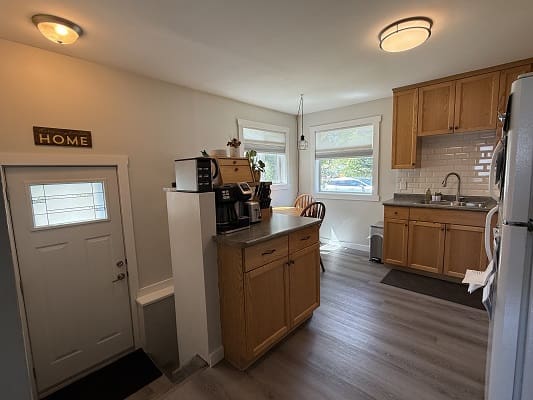 Cozy kitchen with wooden cabinets and decor.