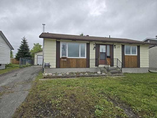 Single-story house with a front yard.