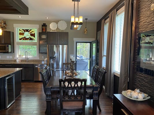 Modern kitchen and dining room interior view.