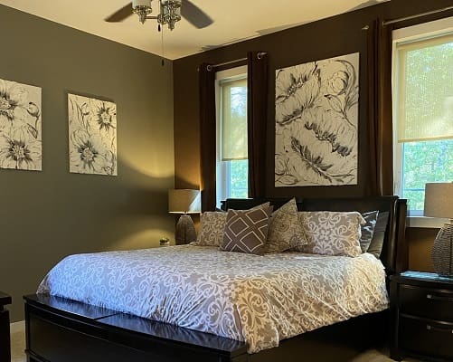 Stylish bedroom with decorative wall art.