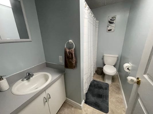 Small bathroom with sink and shower.