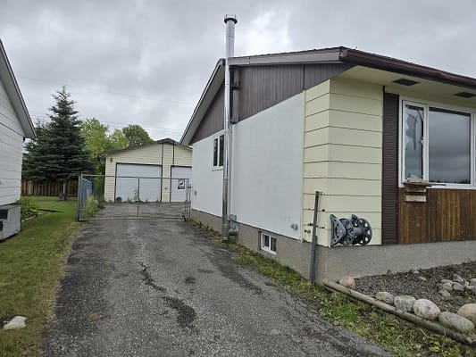 Suburban house with driveway and garage.