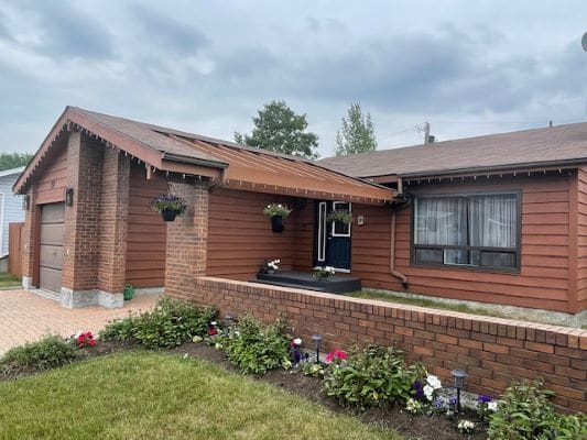Single-story brick house with garden.