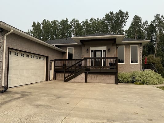 Single-story house with attached garage and porch.