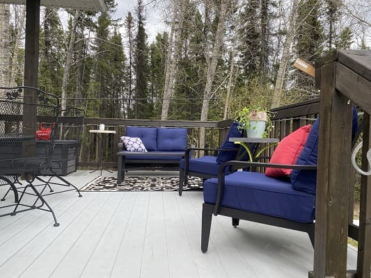 Outdoor patio with blue and red furniture.