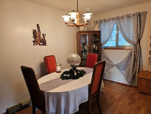 Dining room with table and chandelier.