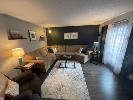 Cozy living room with sectional sofa, rug.