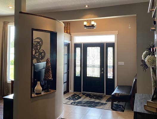 Modern home entryway with decorative elements.
