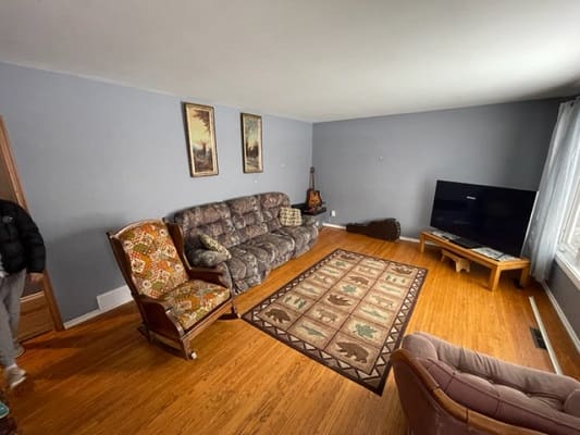 Living room with sofa and television.