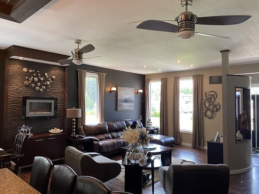 Modern living room with ceiling fans.