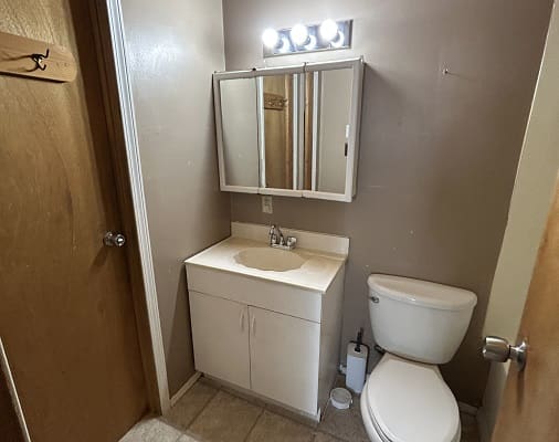 Small bathroom with sink and toilet.