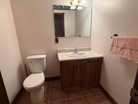 Small bathroom with sink and toilet.