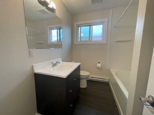 Modern bathroom with sink and bathtub.