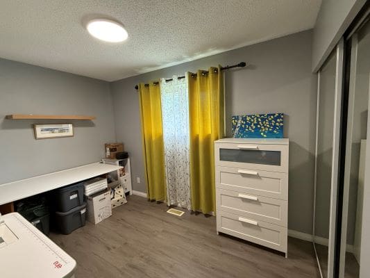Home office with desk and drawers.