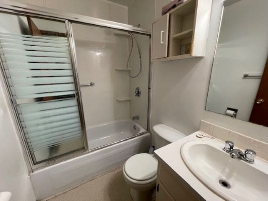 Small bathroom with shower and sink.