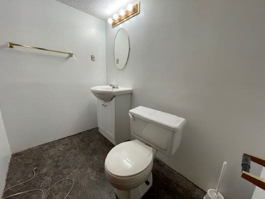 Small bathroom with sink and toilet.