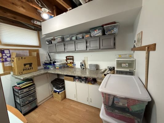Craft room with storage and supplies.