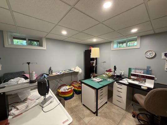 Sewing room with desks and equipment.