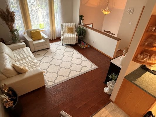 Cozy living room with white furniture.