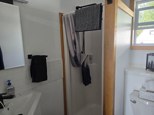 Small bathroom with shower and toilet.