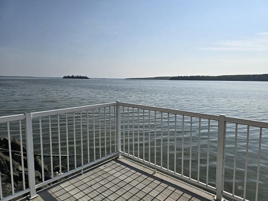 Lakeside view from fenced terrace.