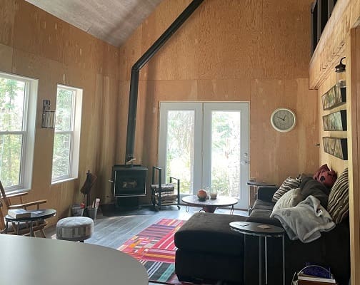Cozy living room with fireplace and sofa.