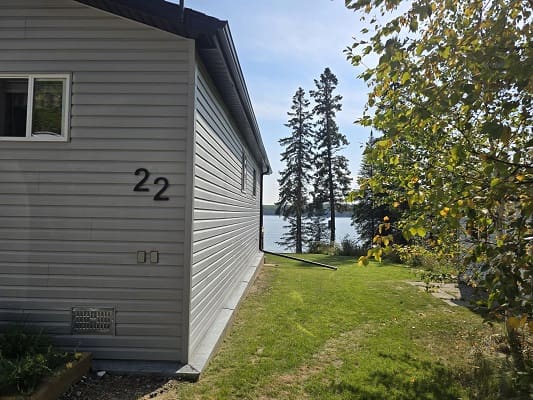 House with number 22 near a lake.