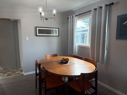 Dining room with round wooden table.