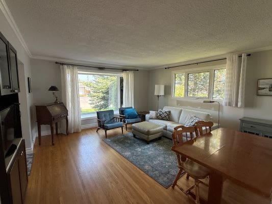 Spacious living room with modern furniture.