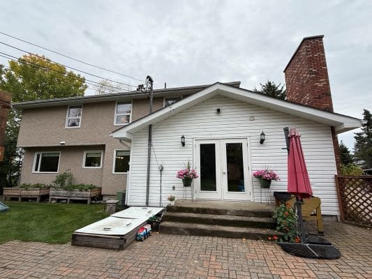Backyard view of house with patio.