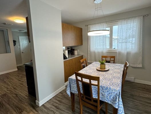 Dining room with table and chairs setup.
