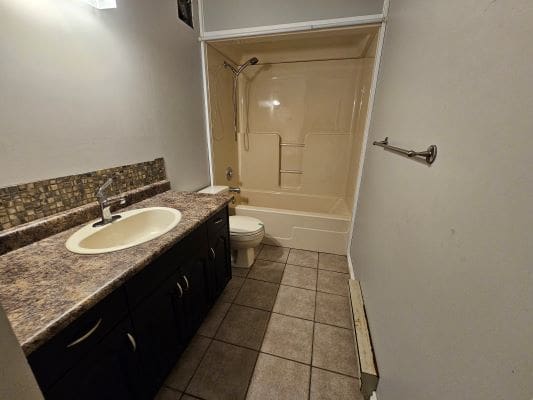 Bathroom with sink, toilet, and bathtub.