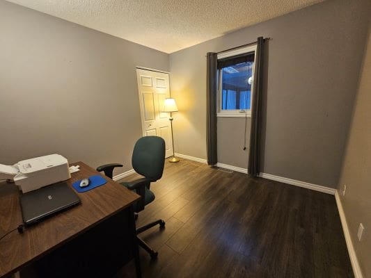 Home office with desk and chair.