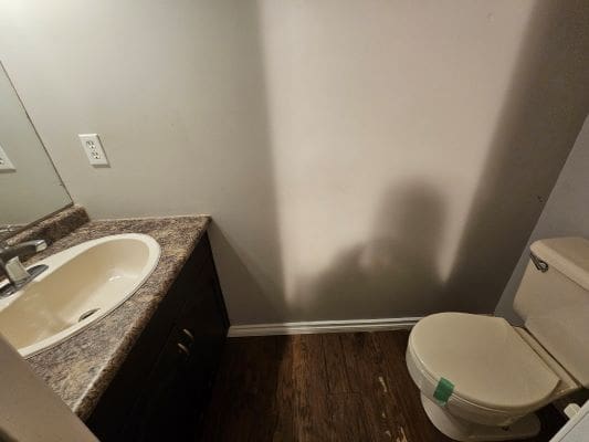 Small bathroom with sink and toilet.