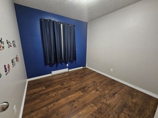 Empty room with blue accent wall.